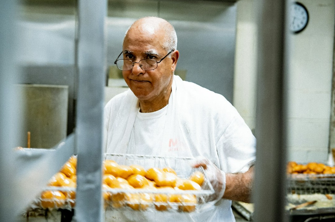 Baker preparing bread in a small family bakery