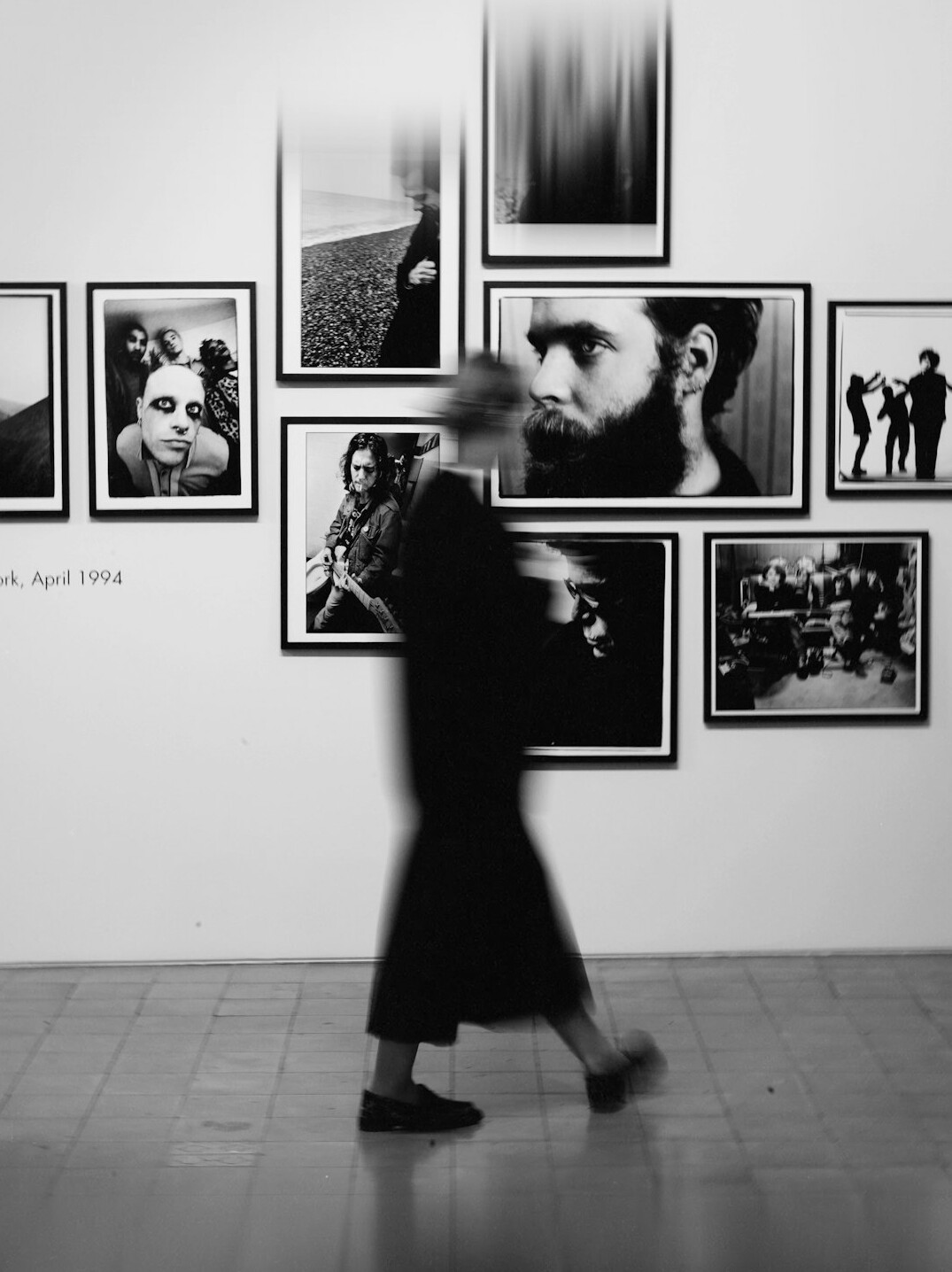 Framed black and white documentary photography prints in a gallery