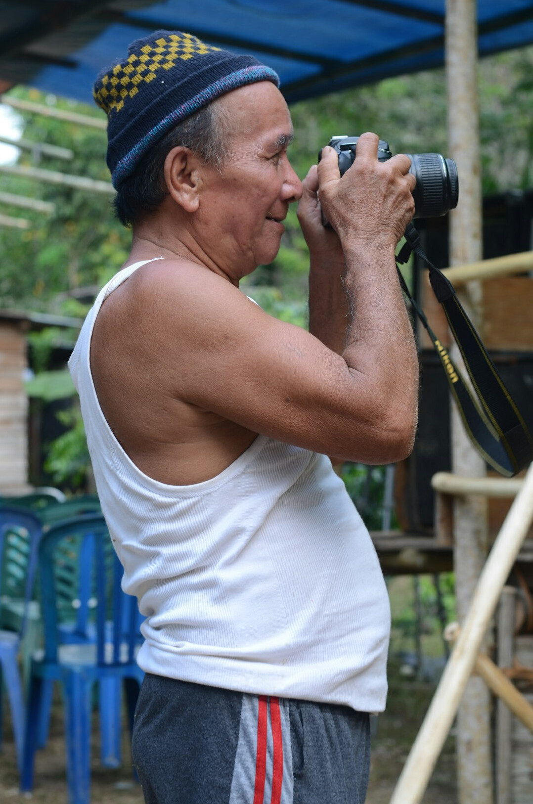 Photographer conducting a recorded interview with a local resident